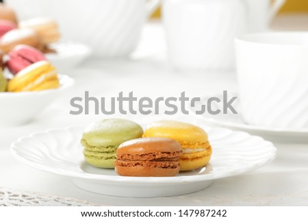Macarons during a snack with tea cup