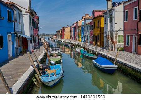 Colorful houses of Burano Island, Venetian Lagoon, northern Italy. The island is famous with colored fishermen's houses at the bank of canals and streets.                         