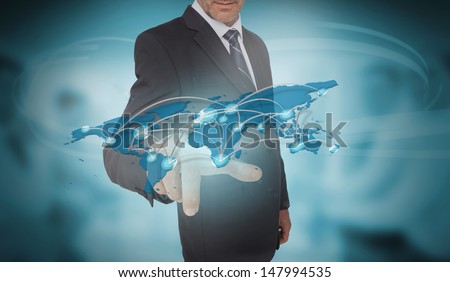 Businessman touching futuristic world map interface on blurry office background