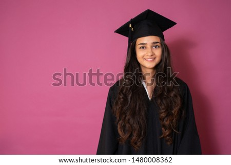 Young woman is celebrating her university degree, picture with copy space 