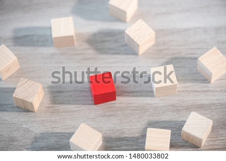 Concept of individuality with wooden cubes