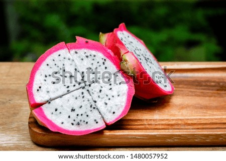 Close Up Dragon Fruit Slice On Wooden Table