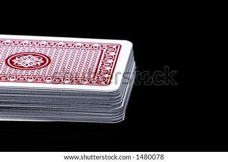 Playing cards on a black background.