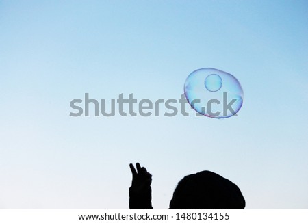 bubble bubbles abstract close-up background hand reach touch chase modern simple design with copyspace stock photo