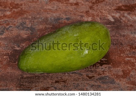 Green tasty mango over background