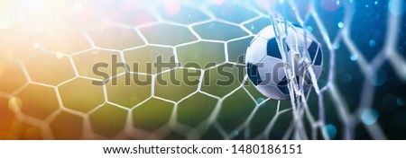 Soccer Ball in Goal on Multicolor Background