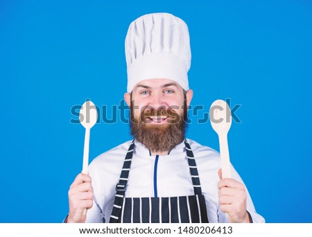 Friendly look. Vegetarian. Mature chef with beard. Bearded man cook in kitchen, culinary. Healthy food cooking. Chef man in hat. Secret taste recipe. Dieting and organic food, vitamin.