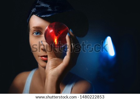 girl holding a balloon with a red planet, space