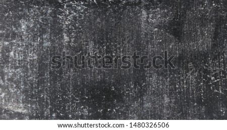Black grey concrete wall with visible scratches and chips