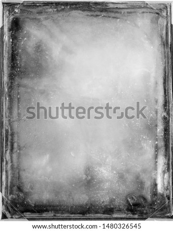 Aged black and white frame with defects and scratches.Background or mask
