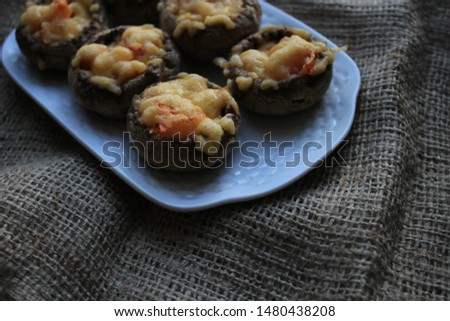 Mushrooms stuffed with vegetables and cheese