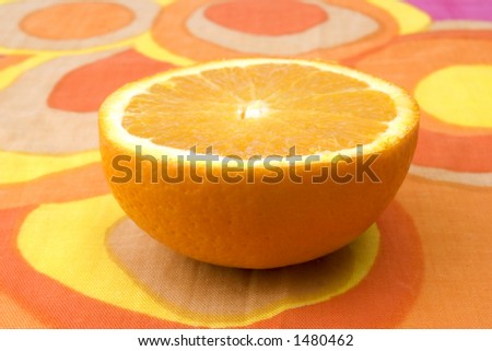 sliced orange on patterned cloth