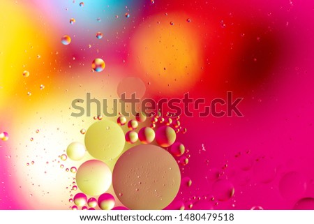 Abstract pattern of colored oil bubbles on water. Oil drops in water abstract psychedelic pattern image. 