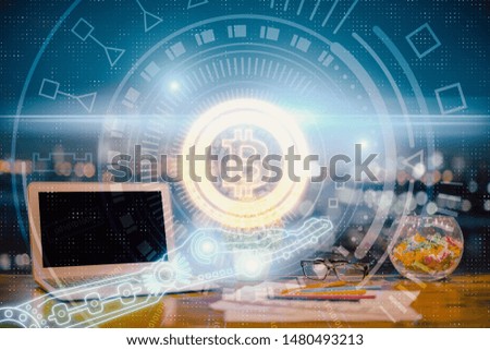 Double exposure of blockchain and crypto economy theme hologram and table with computer background. Concept of bitcoin cryptocurrency.