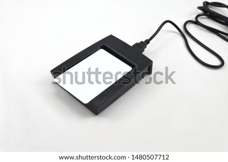 RFID card reader on white background.
