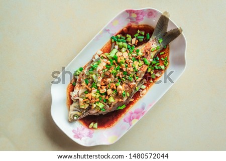 Steamed Wuchang fish on a light background