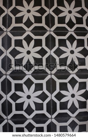 Vintage black and white geometric floral pattern floor tiles