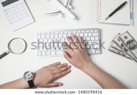 Girl typing on keyboard. Business, Travel