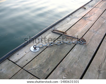 iron boat hook on pier