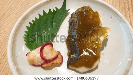 Halibut fish steak serve with green tea sauce and herb