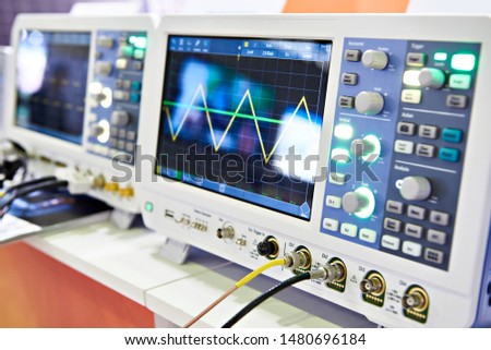 Modern mixed signal oscilloscope in laboratory Royalty-Free Stock Photo #1480696184