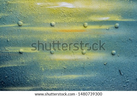 Old iron vintage wall: blue and yellow colors. Banner and copy space for your text or disign. Rough textured plaster wall surface closeup. Old stucco texture. Grunge background.