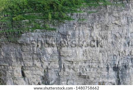 Steep rock cliff,
Cliff surface background Royalty-Free Stock Photo #1480758662