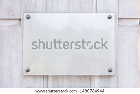 Blank transparent sign plate mockup, Name plate template on the wall 