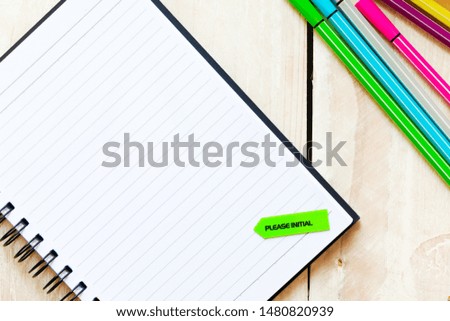 Adhesive note with text Please Initial on white wooden table background