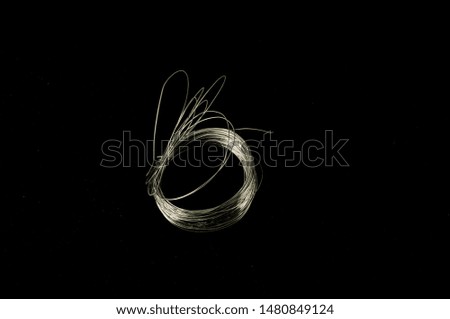 Close-up of metal wire Object on a Black Background