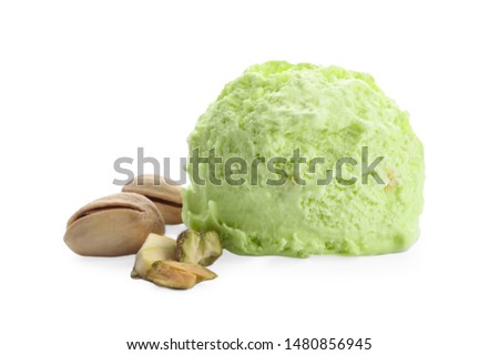 Scoop of delicious pistachio ice cream and nuts on white background