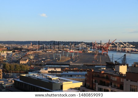 Port of Seattle taken from downtown building at sunset viewing West Seattle, Eliot Bay and Mount Rainier