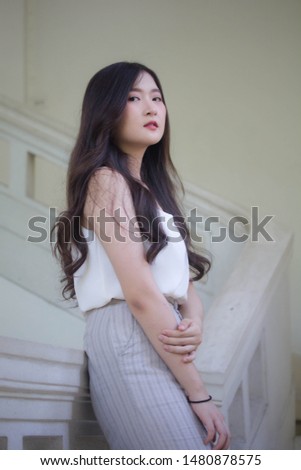 portrait of thai china adult office girl white shirt relax and smile