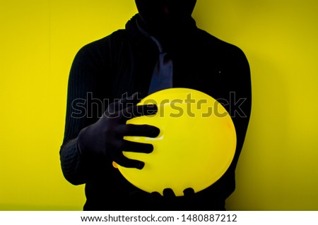 
black silhouette person yellow background
