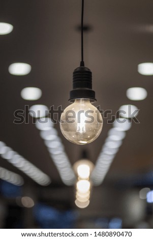 Lighting decor. Retro light bulb filament close up.Illuminated.