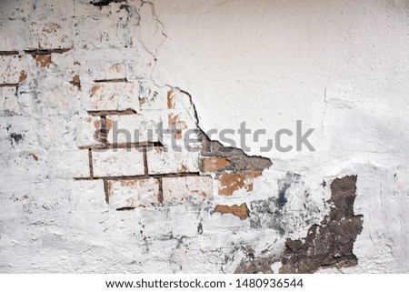 Abandoned house white brick wall