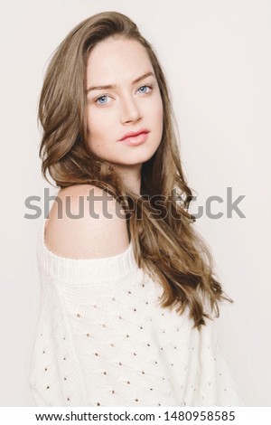 Beautiful Woman with spa healthy skin concept, neat clean make up wrap hair natural look, white background isolated, half body portrait. A classic portrait picture of a young neat woman in white