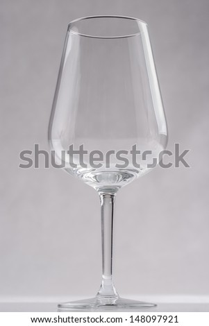 Red wine glass over a solid bright background