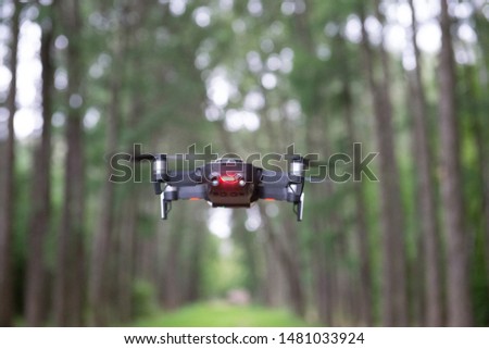 drone quad copter above the ground in a park
