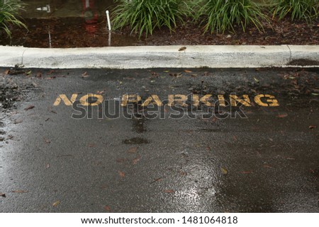 no parking painted on the side of the road