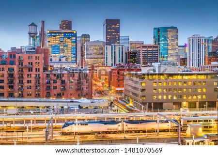 Denver, Colorado, USA downtown cityscape over the train station at twilight.