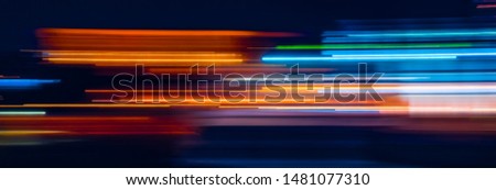 Abstract Rainbow light trails on the dark background Royalty-Free Stock Photo #1481077310