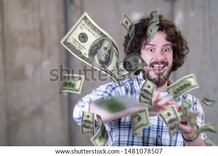 business, people and finances concept  Happy young businessman throwing US dollar banknotes and enjoying while making the rain of money in new startup office