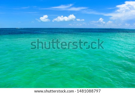 Turquoise water under blue sky. Cancun Mexico
