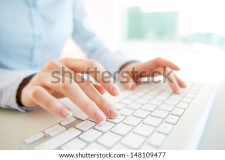 Hands of an office woman typing Royalty-Free Stock Photo #148109477