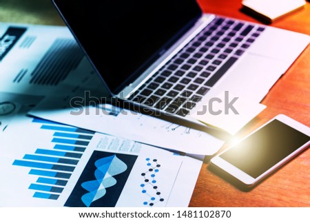 Online business working in professional office with digital smartphone, computer, powerpoint graph presentation. Sign future contract and connect with client using technology