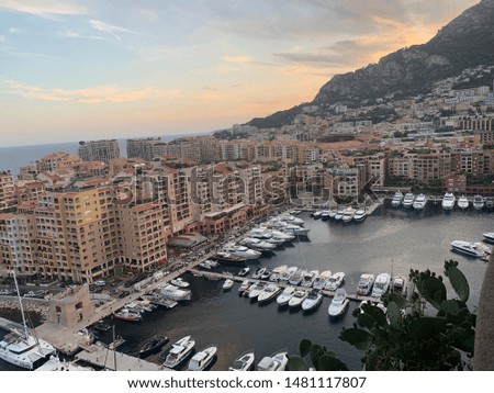 Monaco City, Monaco - August 2 2019: Views from above the princes palace with yachts and sunset three countries italy france in one picture incredible sky and mountains