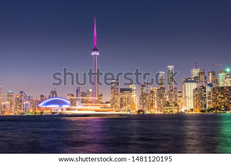 Modern buildings and landmarks in Toronto city skyline at night in Ontario, Canada