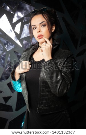 Beautiful goth fashion stylish girl on black studio background