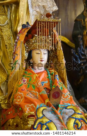 Colorful Taoist goddess sculpture of Queen Mother of the West (Xiwangmu) in Taoist temple in Phuket, Thailand. Selective focus.
